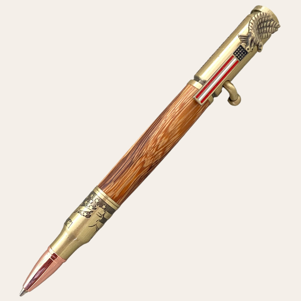 Picture shows a hand turned patriotic pen with a flag for the clip, a serviceman saluting near the nib, and light wood for the barrel. Hand turned by Paul’s Hand Turned Crrarions.