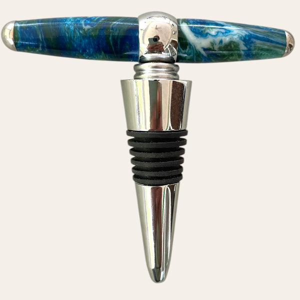 Hand-turned wine topper with built in corkscrew which is chrome with a resin handle called Under The Sea due to the colors of blue, green, and white. Created by Paul’s Hand Turned Creations.