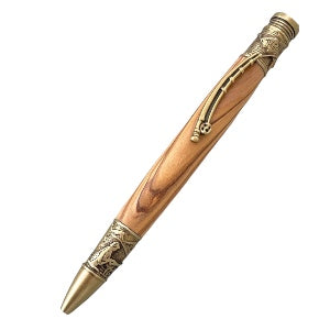 This fly fishing hand turned pen has brass trim.  The rod is the pen clip and near the nib shows a man fishing.  Made by Paul’s hand turned creations. 