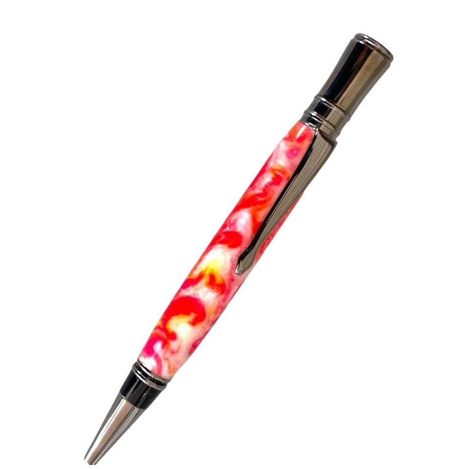 Picture of an executive pen with pink, yellow, and white swirls made from resin with a gun metal trim called Lotus Flower and hand turned by Paul’s hand turned creations