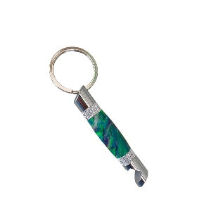 Picture of a hand turned bottle opener keychain made from green and purple resin on a silver trim made by Paul’s hand turned creations.