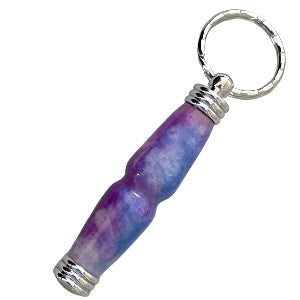  A handcrafted secret compartment keychain with shades of purple, blue, and pink, accented by chrome trim.  This is for the collection secret compartment keychains.  Hand turned bypass hand turned creations. 