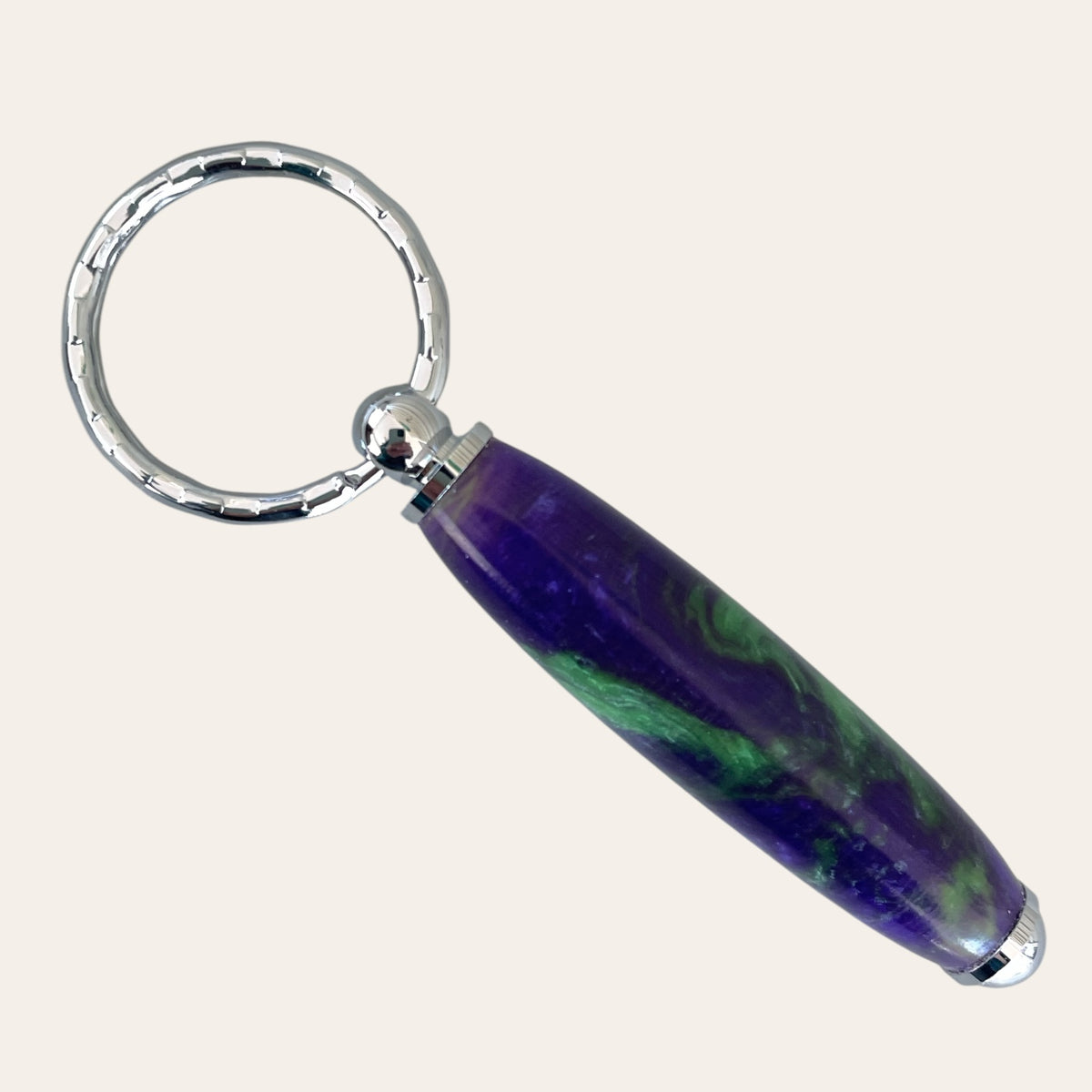 Small Resin Keychain - Aquarius by Paul's, in purple & green with a round silver ring.