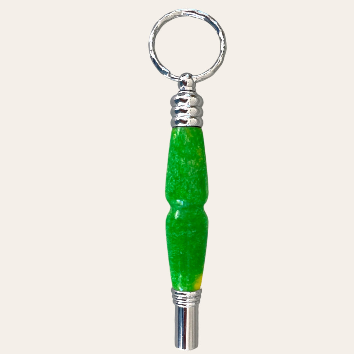 Back of the secret compartment keychain with safety whistle showing green resin made by Paul’s Hand Turned Creations. 