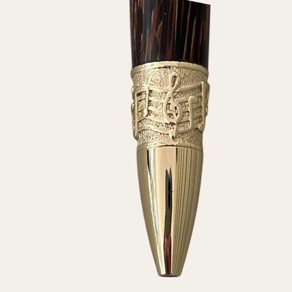 Coconut wood music pen with gold band by Paul's Hand Turned Creations.