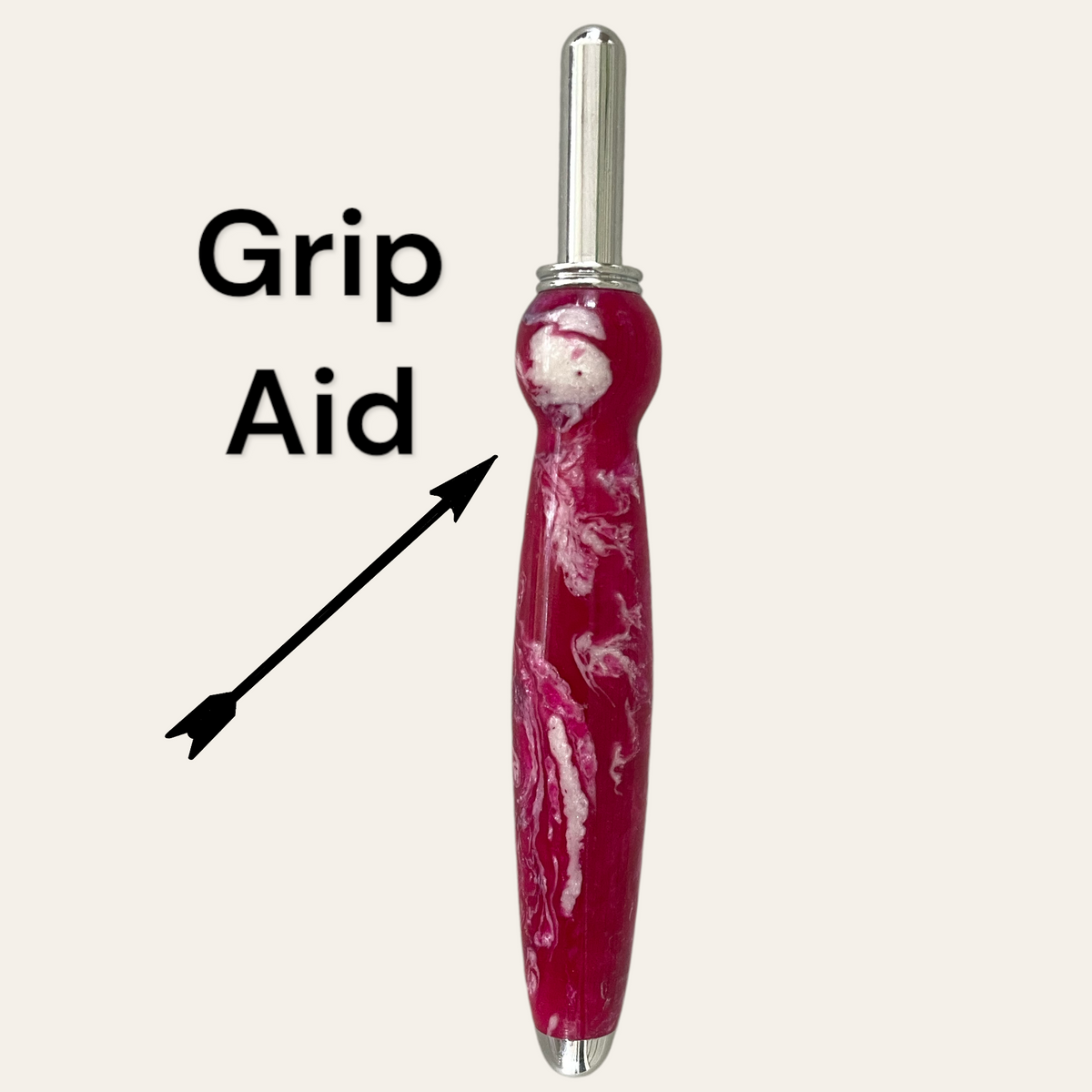 Cranberry seam ripper that shows that a notch is turned into the handle for a grip aid. Paul’s Hand Turned Crearions