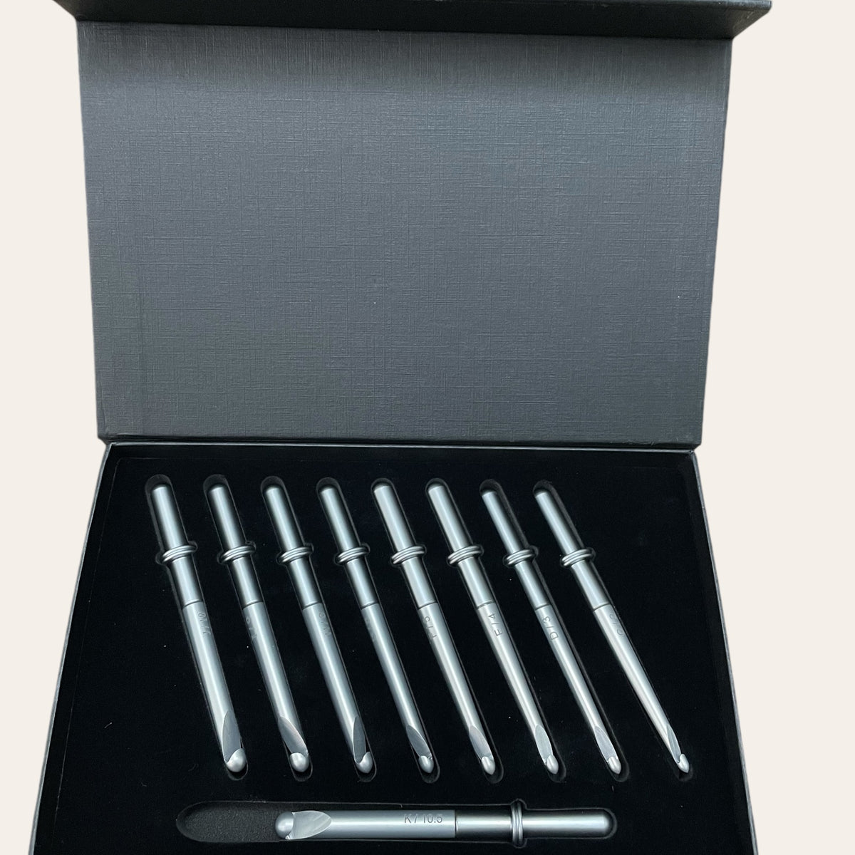 Nine piece hook set displayed in a black box that is included with the hand-turned handle made by Paul’s Hand Turned Creations. 