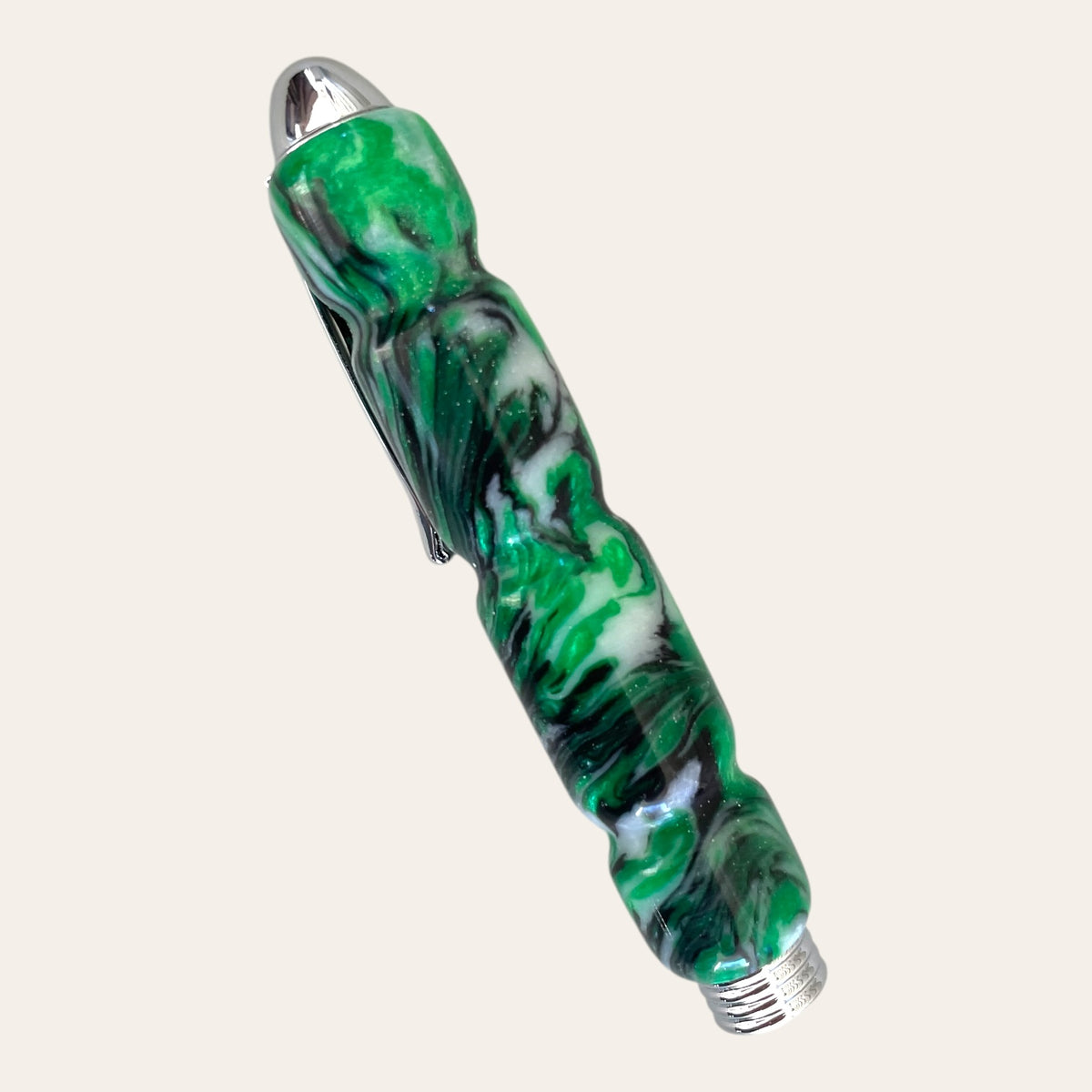 Evergreen Forest pen by Paul's Creations, resin with silver details and clip, on plain background.