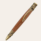 Hand turned Laurel Oak wood on this antique brass trim package pen. Paul's Hand Turned Creations