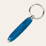 Paul's Hand Turned Creations' Small Resin Keychain - Glitz: Oval, shiny blue with glitter accents.