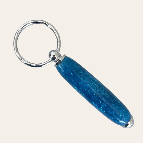 Small Resin Keychain - Glitz by Paul's Hand Turned Creations: Silver, sparkly blue, glittery.