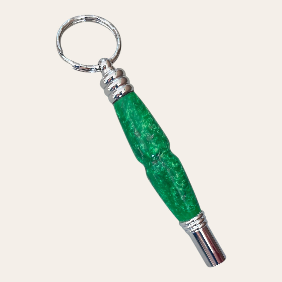 Grass keychain with a secret compartment and whistle, by Paul's Hand Turned Creations.