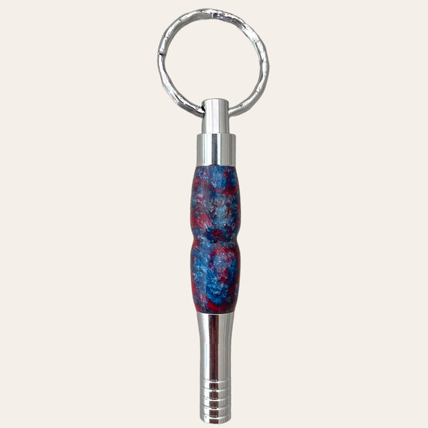 A close-up of the Resin Key Chain with Safety Whistle - Funky, handcrafted by Paul's Hand Turned Creations.