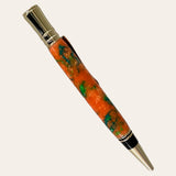 Resin Executive Pen With Chrome Trim - Harmony by Paul's Hand Turned Creations is a handcrafted writing instrument featuring a vibrant, marbled orange and green barrel, complemented by chrome accents on the clip, tip, and top. This pen boasts an ergonomic design and sleek elegance that make it both functional and visually appealing.