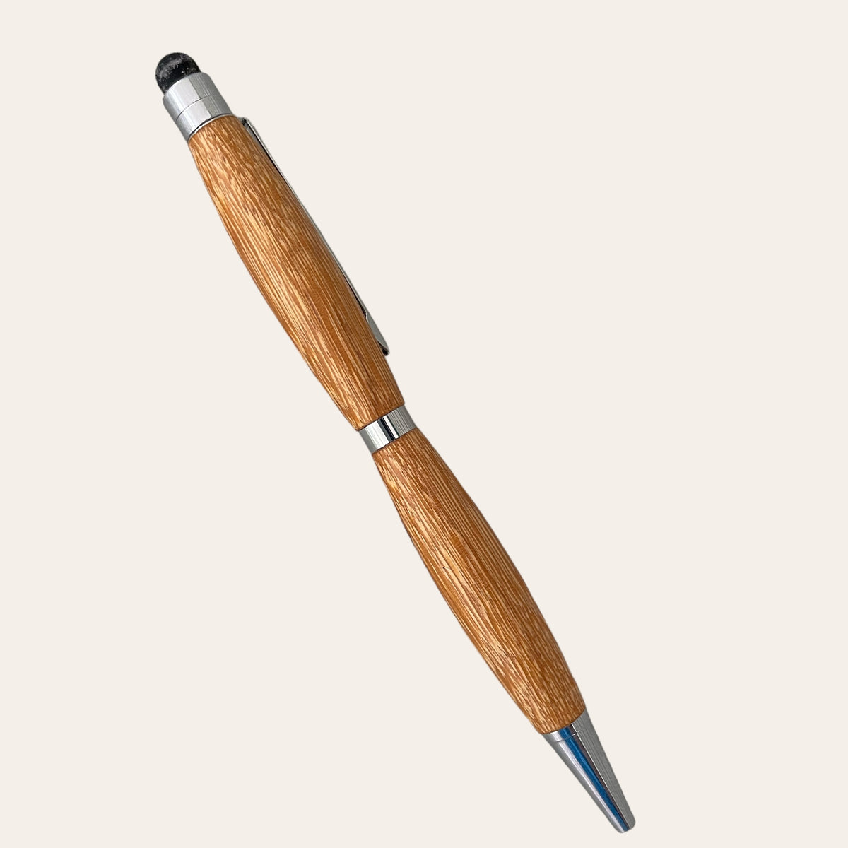 A Marblewood Refillable Stylus Pen with Chrome Trim by Paul's Hand Turned Creations, showcasing a medium ballpoint tip and a brown wooden retractable design adorned with silver accents. The black stylus on the top end complements the slightly textured surface for enhanced grip, all set against a plain white background.