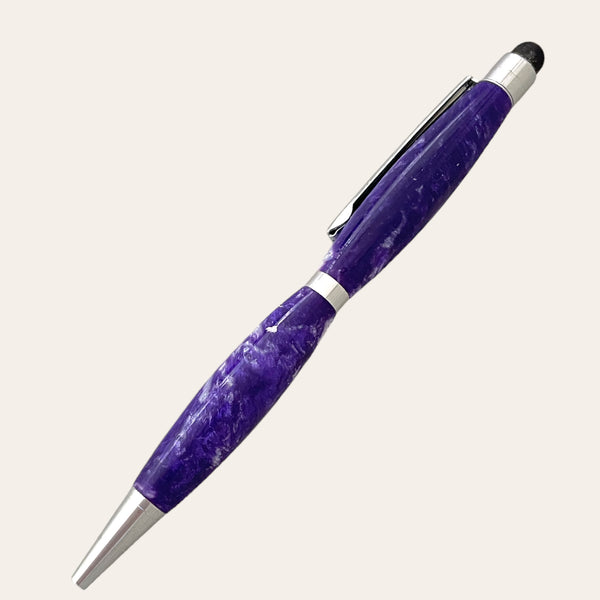 Introducing the Resin Refillable Stylus Pen Chrome Trim - Purple Passion from Paul's Hand Turned Creations: a beautifully crafted, refillable ballpoint pen with a distinctive purple marbled design, silver accents, and an integrated clip. This hand-turned stylus features a rounded body with a gently curved shape and is finished with a small black rubber nub for seamless use on touchscreens.