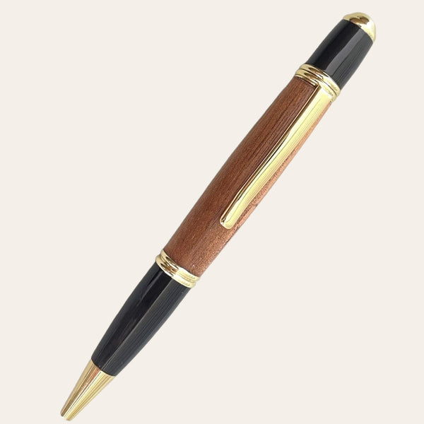 Presenting the luxurious Hand Turned Gatsby Pen With Gold Trim - Spalted Oak by Paul's Hand Turned Creations, this exquisite pen features a polished brown wooden barrel made from spalted oak, black resin accents at the top and bottom, and elegant gold-colored trim. Designed with unique craftsmanship, it includes a clip for attaching to clothes or notebooks and showcases an elegant, refined design.