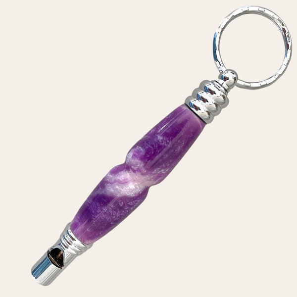 Lilac and white resin safety whistle chrome keychain with a spiral design and a secret compartment to store small items brought to you by Paul's Hand Turned Creations.