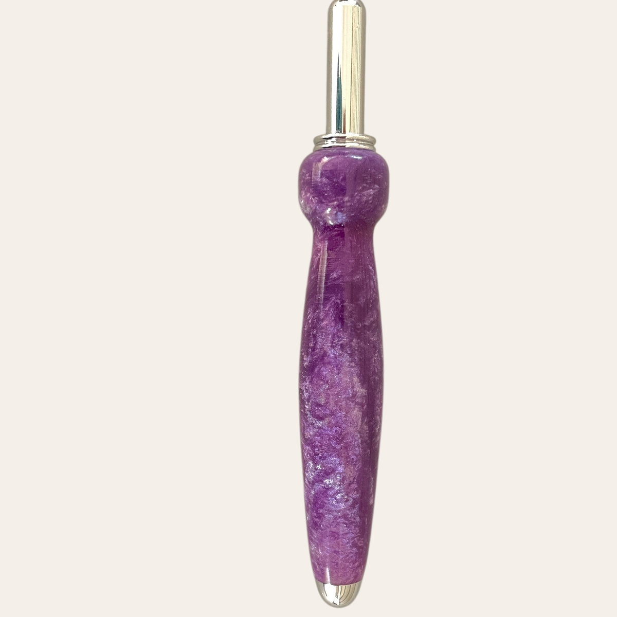 Lilac seam ripper by Paul's: resin handle and silver accents.