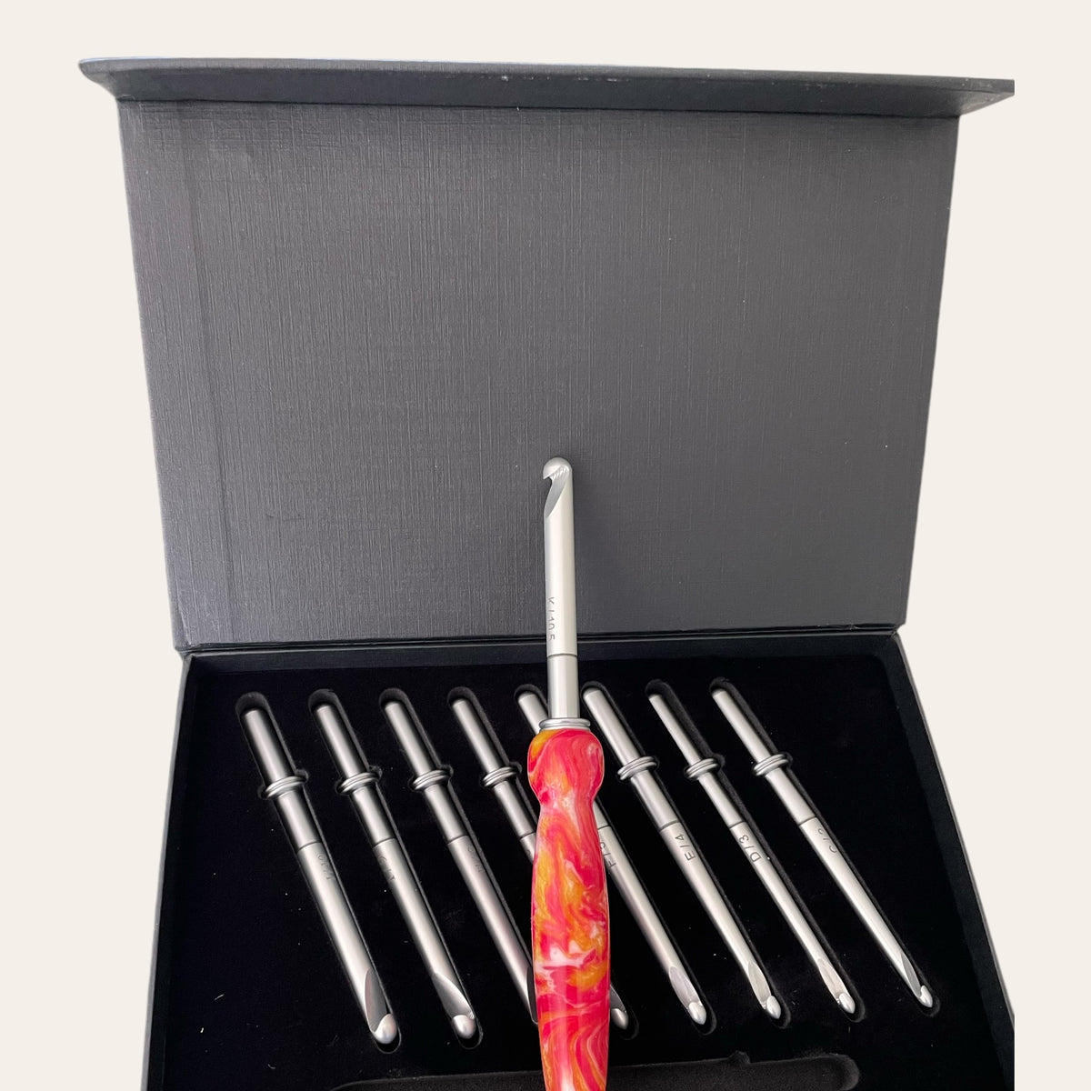 Box set showing the hand-turned handle with nine interchangeable crochet hooks in a black box.  Made by Paul’s Hand Turned Creations. 