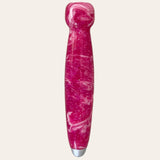 A hand-turned resin crochet handle from Paul's Hand Turned Creations, featuring a pink marbled design with a white tip on the end. The glossy finish and swirling patterns of white and various shades of magenta evoke the vibrant look of a baseball bat, set against a plain light background. This product also includes nine interchangeable hooks for versatile crafting.