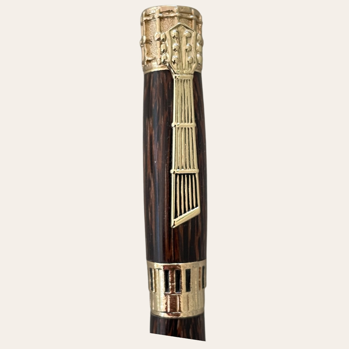 Coconut wood music pen with gold trim by Paul's Hand Turned Creations.