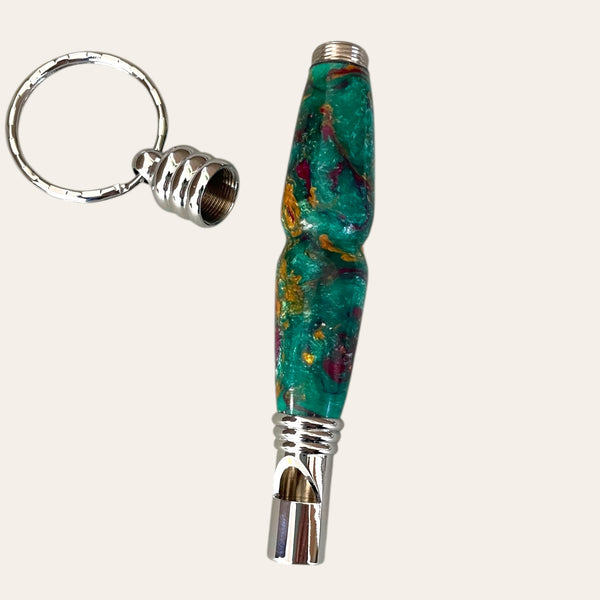 Mystical keychain whistle by Paul's Hand Turned Creations on a light background.