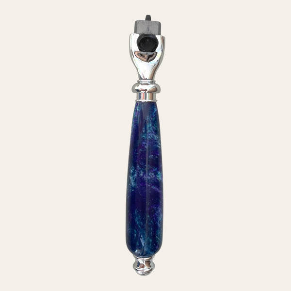 Nightfall razor with silver accents and a marbled blue handle.