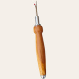 Olive wood seam ripper by Paul's Hand Turned Creations on a light background.