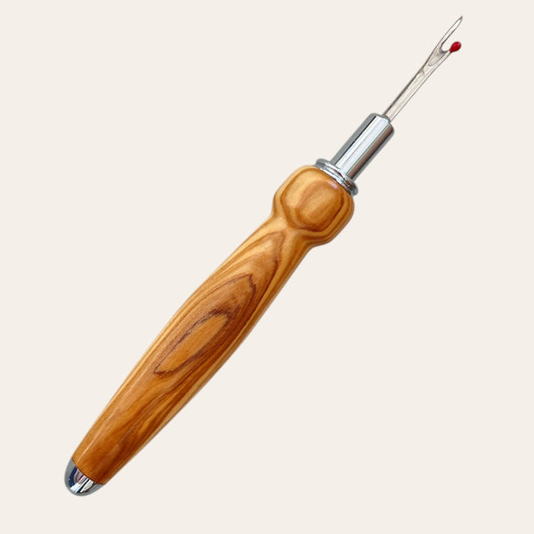 Exotic Bethlehem Olive Wood Seam Ripper by Paul's Hand Turned Creations on white background.