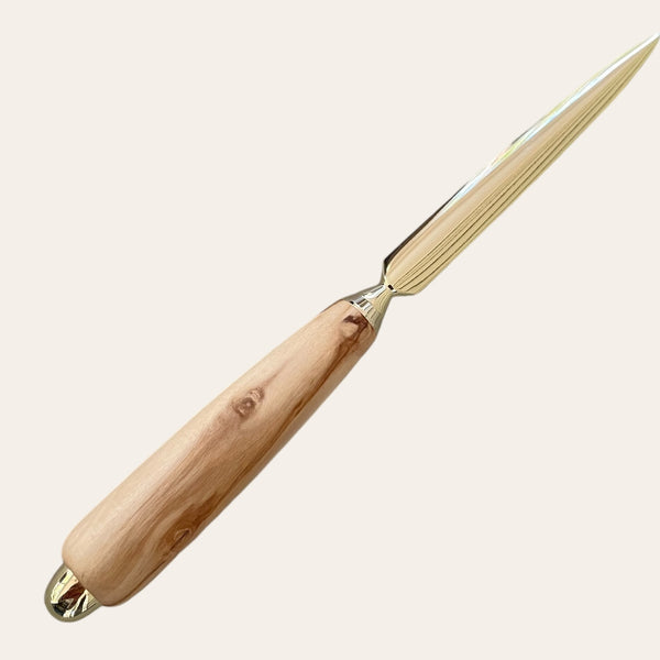 Introducing the Olive Wood Hand Turned Letter Opener by Paul's Hand Turned Creations, featuring a pointed metal blade and an exquisite olive wood handle. This handmade desk accessory adds elegance to any workspace.