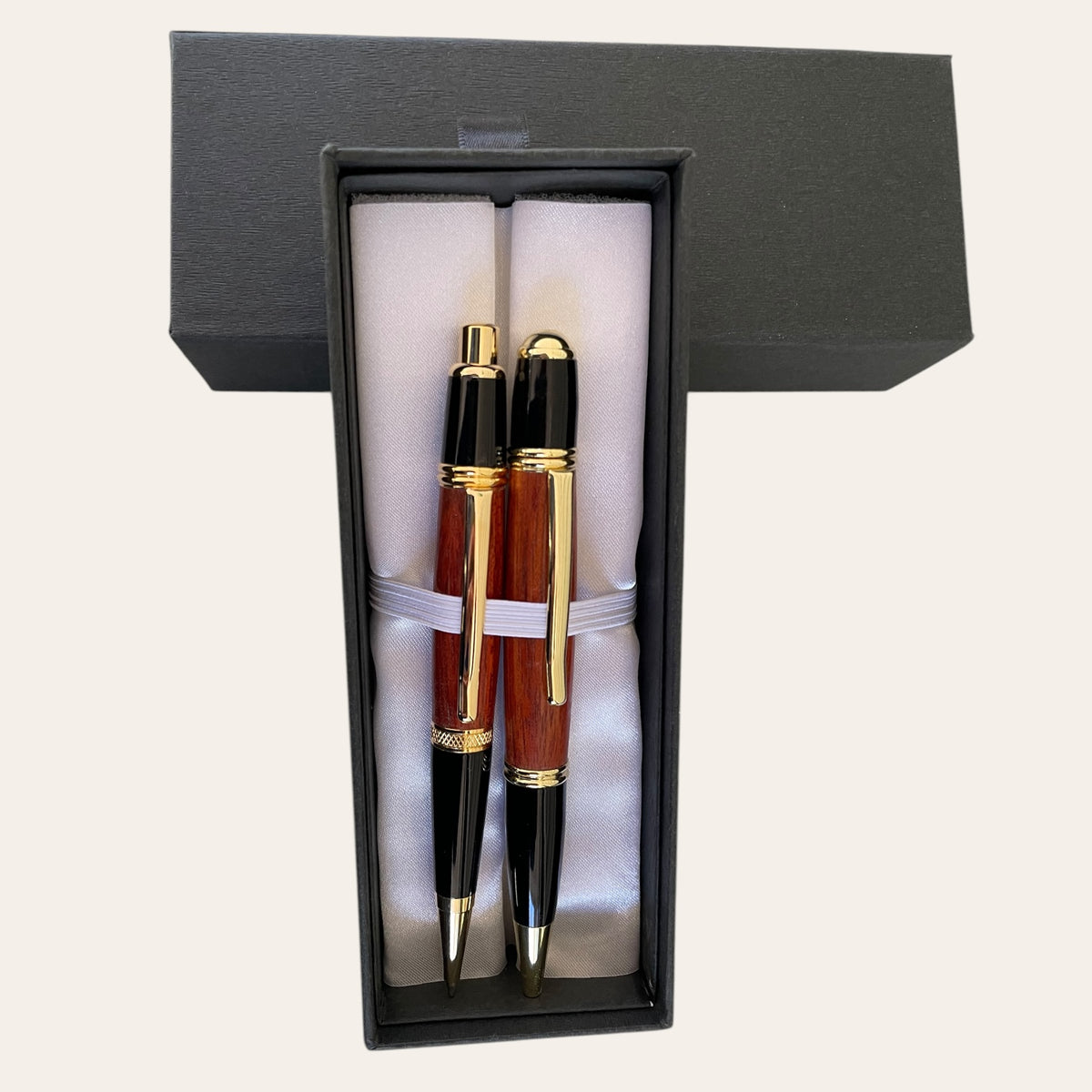 Gatsby Pen and Pencil Set: Elegant Padauk wood pens in a luxe black gift box by Paul's Hand Turned Creations.