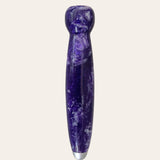 Introducing the Purple Passion, a stunning creation by Paul's Hand Turned Creations. This cylindrical massage wand boasts a sleek, smooth texture with light marbled patterns, enhanced by its elegant resin handle that tapers to a narrower end. A metallic cap at the bottom adds to its sophisticated design, making it both functional and stylish for your relaxation needs.