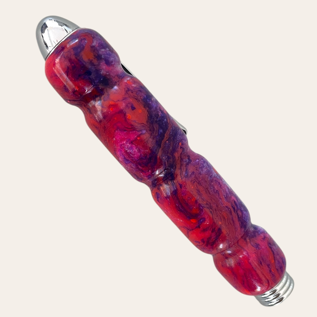 Razzle Dazzle flashlight like Paul's Hand Turned Tweezer Case in red/purple marble.