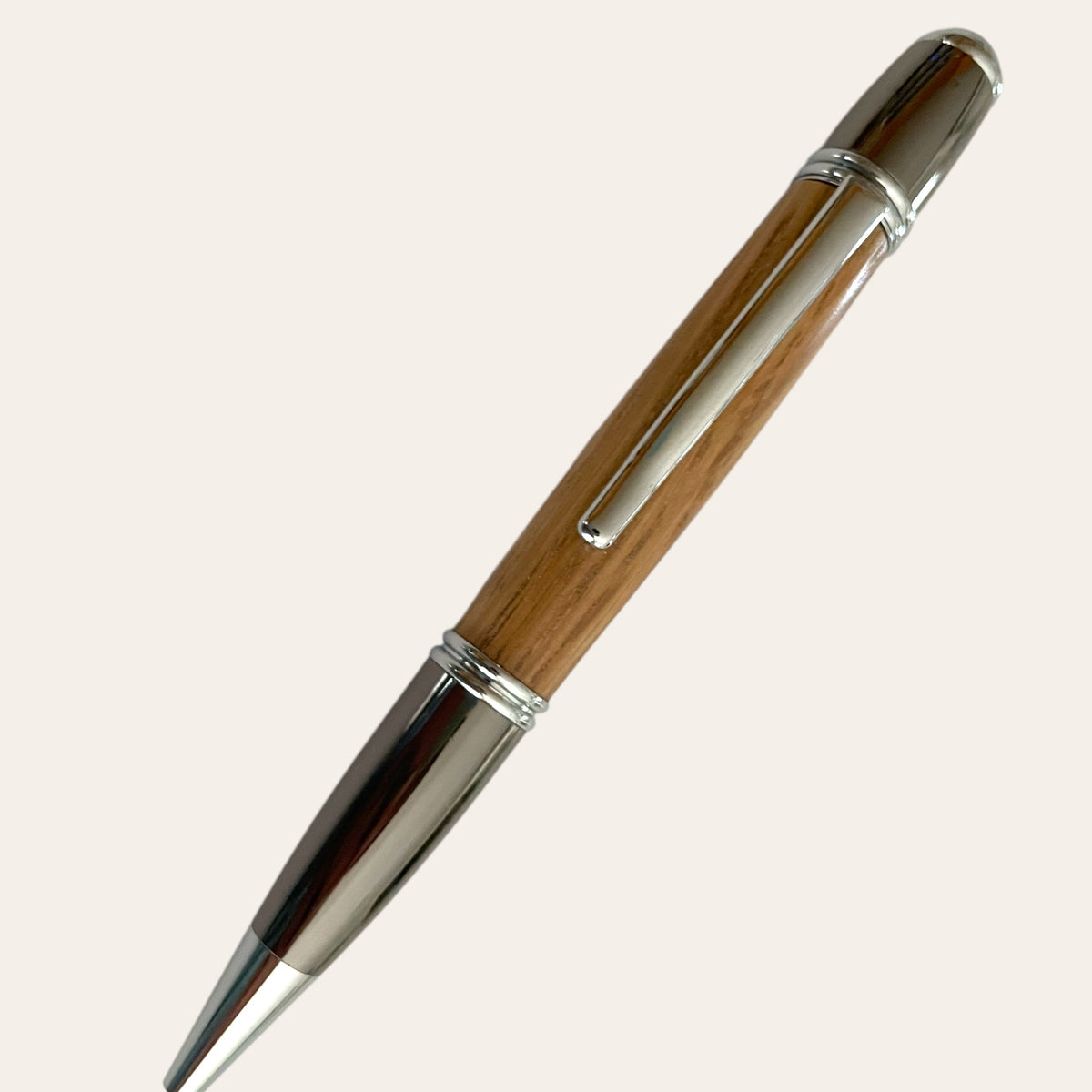 Gatsby Refillable Pen with Gun Metal Trim by Paul's, crafted from Red Oak Wood.