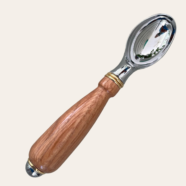 The Red Oak Wood Hand Turned Ice Cream Scoop by Paul's Hand Turned Creations, featuring a handcrafted wooden handle and unique craftsmanship.