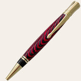 Red and black spectraply wood on the executive pen with gold trim. Paul's Hand Turned Creations