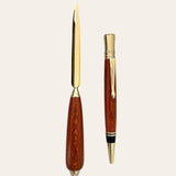 Executive pen and letter opener set on gold trim made from leopard wood. Paul's Hand Turned creations