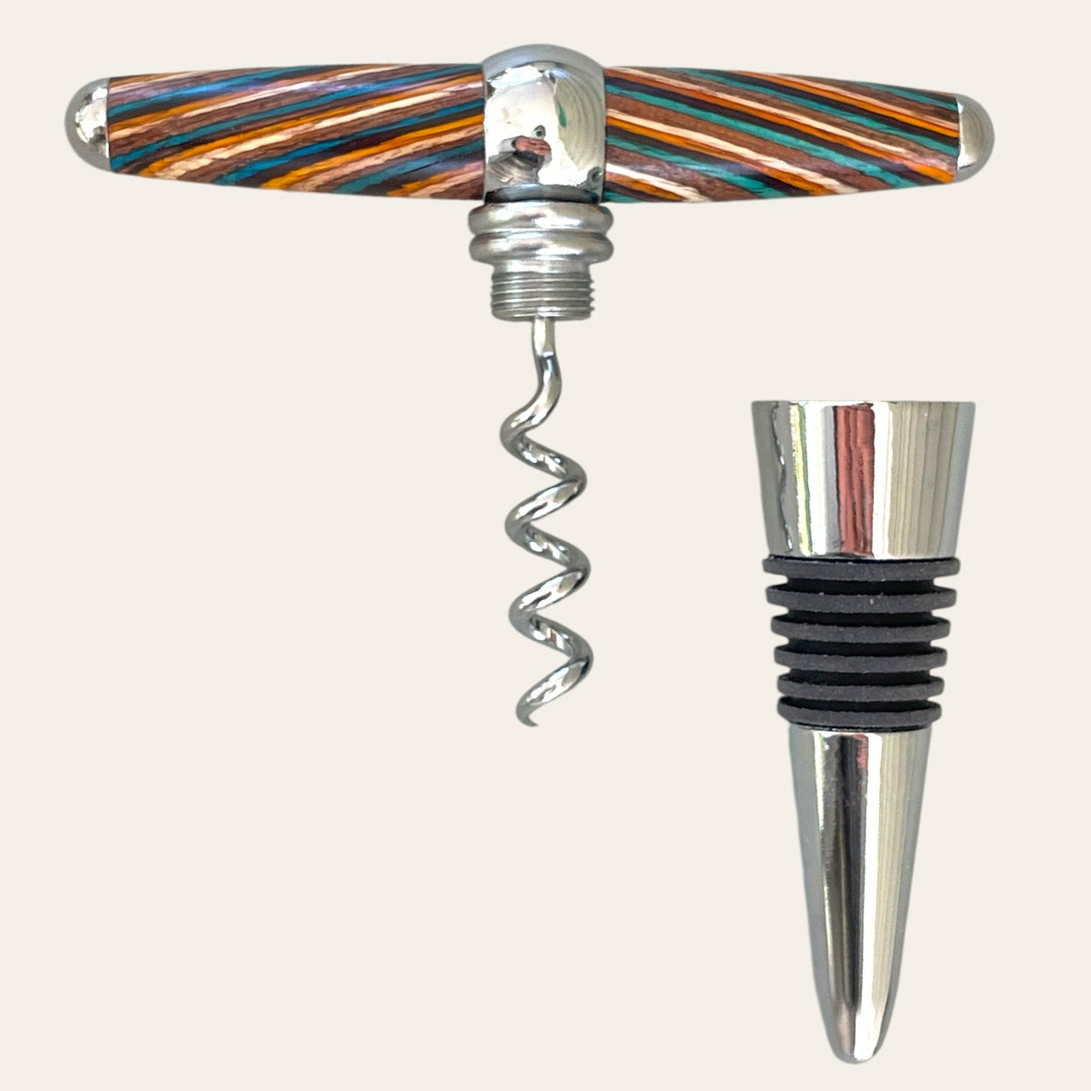 The Southwest Hand Turned T-Handle Winetopper Corkscrew from Paul's Hand Turned Creations, featuring a vibrant handle, is paired with an elegant chrome wine stopper accented with black rings.