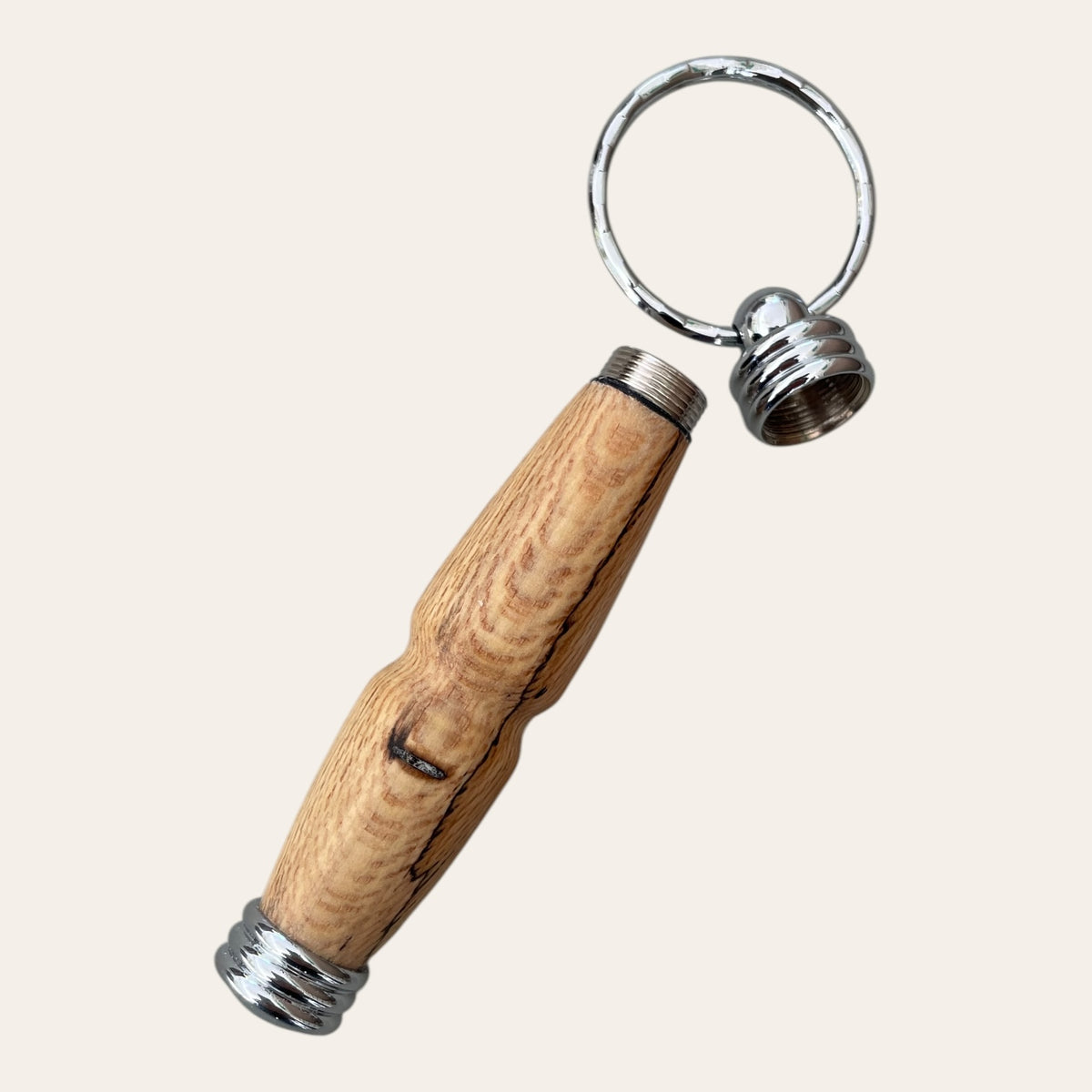 Paul's Hand Turned Creations keychain uncovers a secret compartment, spalted maple finish.