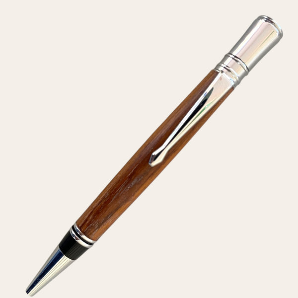 Paul's Hand Turned Creations' Teak Wood Pen features chrome trim and sleek craftsmanship.