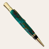 A teal executive pen with gold trim from Paul's lies diagonally on a beige background.