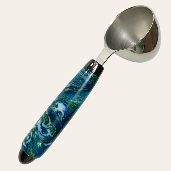 Resin handle coffee scoop called Under The Sea with colors of blue, green, and white swirl pattern.  Hand-turned by Paul’s Hand Turned Creations. 