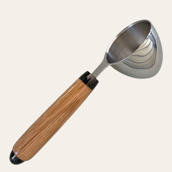 White Oak hand-turned coffee scoop by Paul's Hand Turned Creations on a plain background.