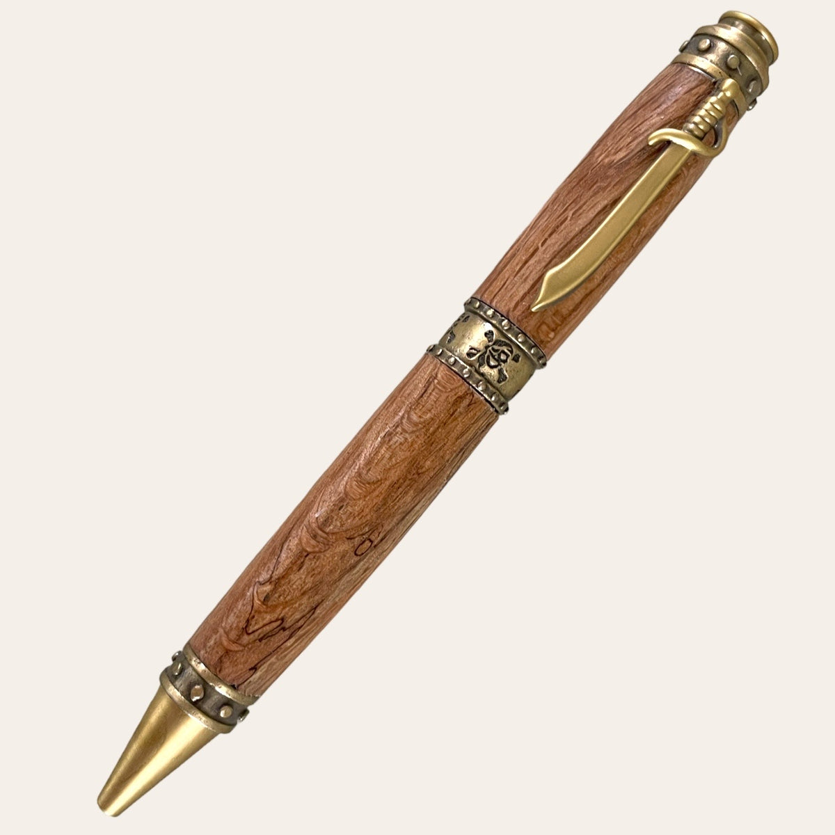 Pirate pen trimmed in gold and is hand turned out of Laurel Oak wood. Paul's Hand Turned Creations